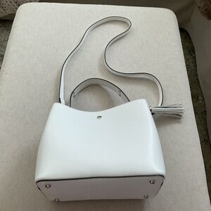 White leather handbag.